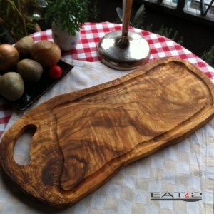 Cutting board olive wood, natural shaped and with a juice groove